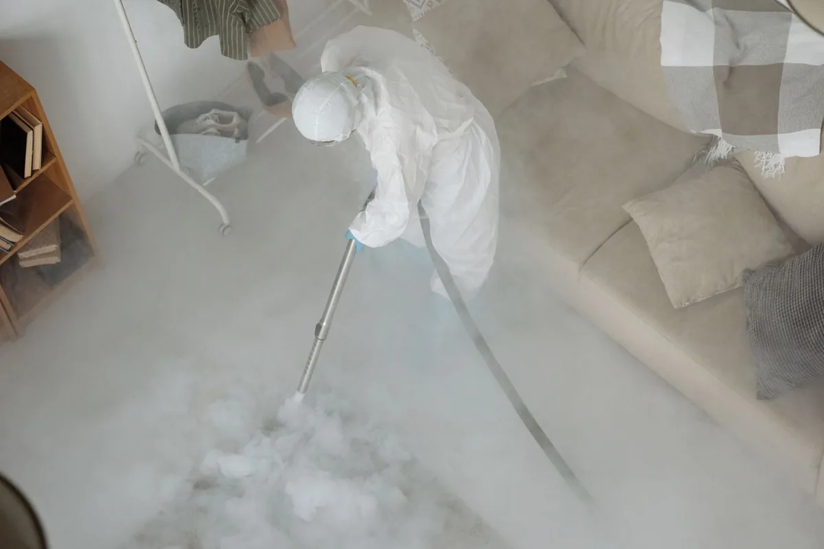 Biohazard cleanup technician in protective equipment, Vancleave, MS